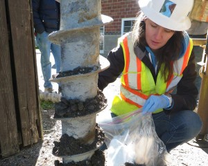 worker testing soil samples